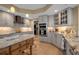 Bright kitchen featuring marble countertops, stainless steel appliances, and custom cabinetry at 3621 North Point Rd # 603, Osprey, FL 34229