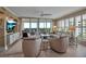 Comfortable living room with views and access to the outdoor patio at 3621 North Point Rd # 603, Osprey, FL 34229