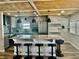 Modern kitchen boasts a large island with bar seating, stainless steel appliances, and stylish pendant lighting at 3710 Gulf Of Mexico Dr # E22, Longboat Key, FL 34228