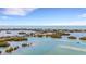 Breathtaking aerial view of a coastal community featuring waterfront access and lush tropical landscaping at 3921 Waypoint Ave, Osprey, FL 34229
