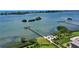 Scenic aerial view featuring a community pier, waterfront access, and lush green landscaping at 3921 Waypoint Ave, Osprey, FL 34229