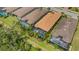 Aerial view of tile roofs, screened in lanais, and backyard pools in a lush tropical community at 3921 Waypoint Ave, Osprey, FL 34229