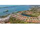 Scenic aerial view of a waterfront community with homes, lakes, and ocean views on a sunny day at 3921 Waypoint Ave, Osprey, FL 34229