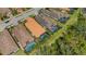 Aerial view of homes with tile roofs, screened in lanais, and private pools in a tropical community at 3921 Waypoint Ave, Osprey, FL 34229