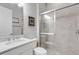Clean, bright bathroom with glass-enclosed shower, granite countertop, and tiled floor at 3921 Waypoint Ave, Osprey, FL 34229