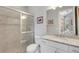 Modern bathroom with a glass-enclosed shower, granite countertop vanity, and stylish fixtures at 3921 Waypoint Ave, Osprey, FL 34229
