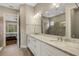 Bathroom with double sinks, granite countertops and large mirror at 3921 Waypoint Ave, Osprey, FL 34229