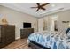 Comfortable bedroom with ceiling fan and view of the closet at 3921 Waypoint Ave, Osprey, FL 34229