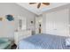 Bright bedroom featuring a blue and white color scheme, stylish decor, and closet at 3921 Waypoint Ave, Osprey, FL 34229