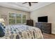Brightly lit bedroom with two dressers and a ceiling fan at 3921 Waypoint Ave, Osprey, FL 34229