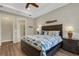 Comfortable bedroom with a door to the bathroom and a coastal-themed decor at 3921 Waypoint Ave, Osprey, FL 34229