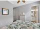 Comfortable bedroom with a dresser and an ensuite bathroom featuring stylish interior design at 3921 Waypoint Ave, Osprey, FL 34229