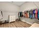 Walk-in closet features storage for clothes, shoes and accessories at 3921 Waypoint Ave, Osprey, FL 34229
