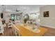 Open-concept layout connecting the dining area to the living room and kitchen at 3921 Waypoint Ave, Osprey, FL 34229