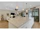 Spacious kitchen island with white cabinets and ample counter space at 3921 Waypoint Ave, Osprey, FL 34229