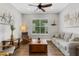 Cozy living room with wood accents, comfortable seating, and sailboat decoration at 3921 Waypoint Ave, Osprey, FL 34229
