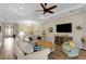 Comfortable living room featuring a ceiling fan and view into the entryway at 3921 Waypoint Ave, Osprey, FL 34229