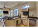 Outdoor kitchen with granite counters, stainless steel appliances, and a comfortable dining area at 3921 Waypoint Ave, Osprey, FL 34229