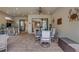 Covered outdoor patio includes a dining table, bar, and seating area, perfect for relaxing poolside at 3921 Waypoint Ave, Osprey, FL 34229