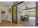 Covered patio leading to a screened-in pool area with dining table at 3921 Waypoint Ave, Osprey, FL 34229