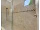 Large walk-in shower with stone floor and tile walls at 3921 Waypoint Ave, Osprey, FL 34229