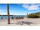 Relaxing waterfront area with Adirondack chairs under blue skies at 3921 Waypoint Ave, Osprey, FL 34229