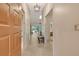 View into the foyer featuring a pendant light fixture and tiled floors leading into the living areas at 3954 Wilshire Cir # 165, Sarasota, FL 34238