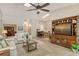 Bright living room with a media center, neutral colors, and lots of natural light at 3954 Wilshire Cir # 165, Sarasota, FL 34238