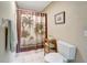 Bathroom featuring a shower with a themed curtain and a tiled floor at 4030 Worcester Rd, Sarasota, FL 34231