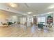 Spacious community room with tables, chairs, ceiling fans, and outside access at 4040 Ironwood Cir # 401F, Bradenton, FL 34209
