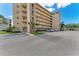 Condo building featuring a parking lot at 4040 Ironwood Cir # 401F, Bradenton, FL 34209
