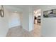 Hallway leading to the kitchen with stainless steel appliances at 4040 Ironwood Cir # 401F, Bradenton, FL 34209