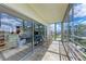 Breezy enclosed patio with glass doors offers views to living area and out to surrounding community at 4040 Ironwood Cir # 401F, Bradenton, FL 34209