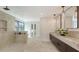 An amazing bathroom with a large shower, dual sinks, and a relaxing soaking tub at 465 E Royal Flamingo Dr, Sarasota, FL 34236