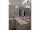 Bright bathroom featuring double sinks with a large mirror and great vanity lighting at 4707 1St E Ave # 4707, Palmetto, FL 34221