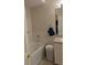 Clean bathroom featuring a bathtub, white tiling, and updated fixtures at 4707 1St E Ave # 4707, Palmetto, FL 34221