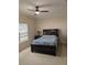 Spacious bedroom featuring a ceiling fan, a large bed, and neutral paint at 4707 1St E Ave # 4707, Palmetto, FL 34221