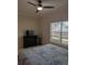 Cozy bedroom with ceiling fan, large window, and a comfortable bed at 4707 1St E Ave # 4707, Palmetto, FL 34221