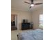 Bedroom showcasing a dresser and doorway to another room at 4707 1St E Ave # 4707, Palmetto, FL 34221