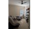 Small bedroom features a ceiling fan, a window with blinds, and neutral decor at 4707 1St E Ave # 4707, Palmetto, FL 34221