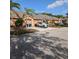 Exterior of the townhome with private driveways and well-kept landscaping at 4707 1St E Ave # 4707, Palmetto, FL 34221