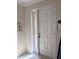 Elegant front door with decorative glass sidelight and tiled floor in entryway at 4707 1St E Ave # 4707, Palmetto, FL 34221