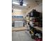 Organized garage with washer and dryer, storage shelves, and work bench area at 4707 1St E Ave # 4707, Palmetto, FL 34221