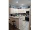 Well-lit kitchen features granite countertops and stainless steel appliances at 4707 1St E Ave # 4707, Palmetto, FL 34221