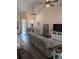 Open-concept living room with high ceilings and modern ceiling fans at 4707 1St E Ave # 4707, Palmetto, FL 34221