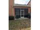 Exterior of screened patio with furniture set. The home has a private back yard at 4707 1St E Ave # 4707, Palmetto, FL 34221