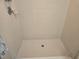 Clean shower with tile surround and updated shower head at 4707 1St E Ave # 4707, Palmetto, FL 34221