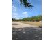 View of the street and a grassy common area showcasing the well-maintained landscaping at 4707 1St E Ave # 4707, Palmetto, FL 34221