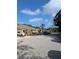 Street view featuring sidewalks, colorful houses, landscaped yards and multiple parked cars at 4707 1St E Ave # 4707, Palmetto, FL 34221