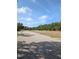 View of the street and a grassy common area showcasing the well-maintained landscaping at 4707 1St E Ave # 4707, Palmetto, FL 34221